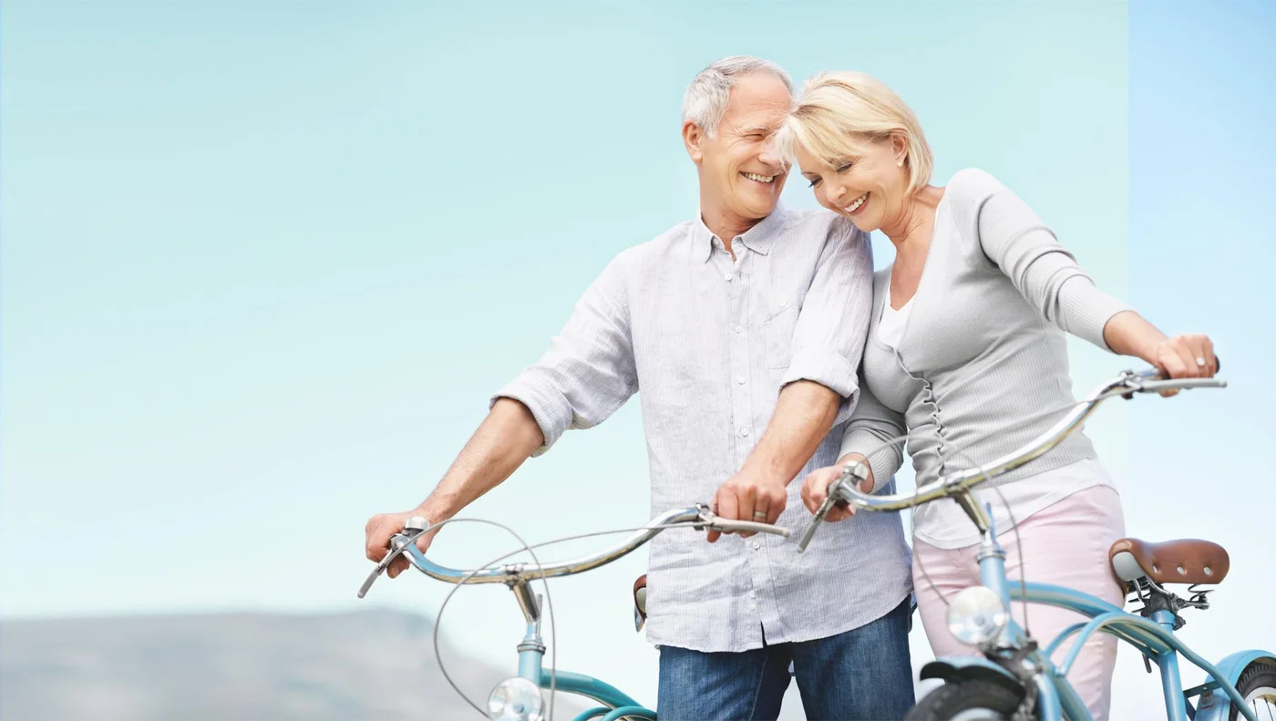 An active older couple with bicycles, the everyday audience for Glucolyn